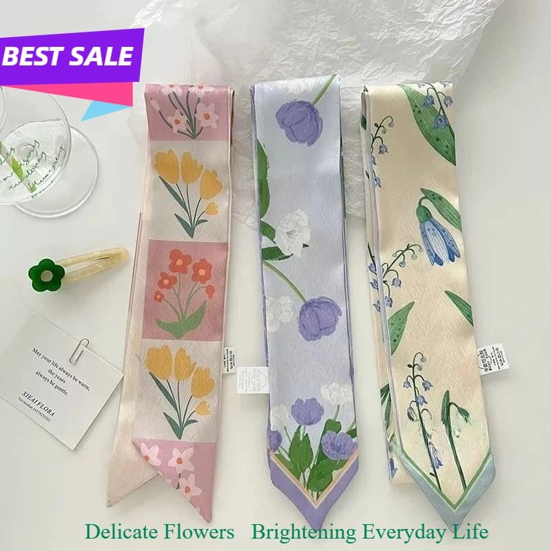 A must-have for a soft, feminine look: a narrow silk scarf, hairband, neckerchief or bag tie